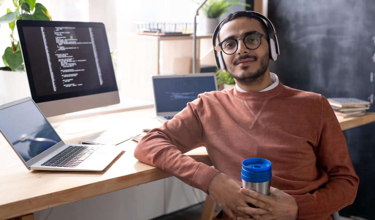 handsome programmer in headphones listening to mus 2023 11 27 04 56 48 utc.jpg